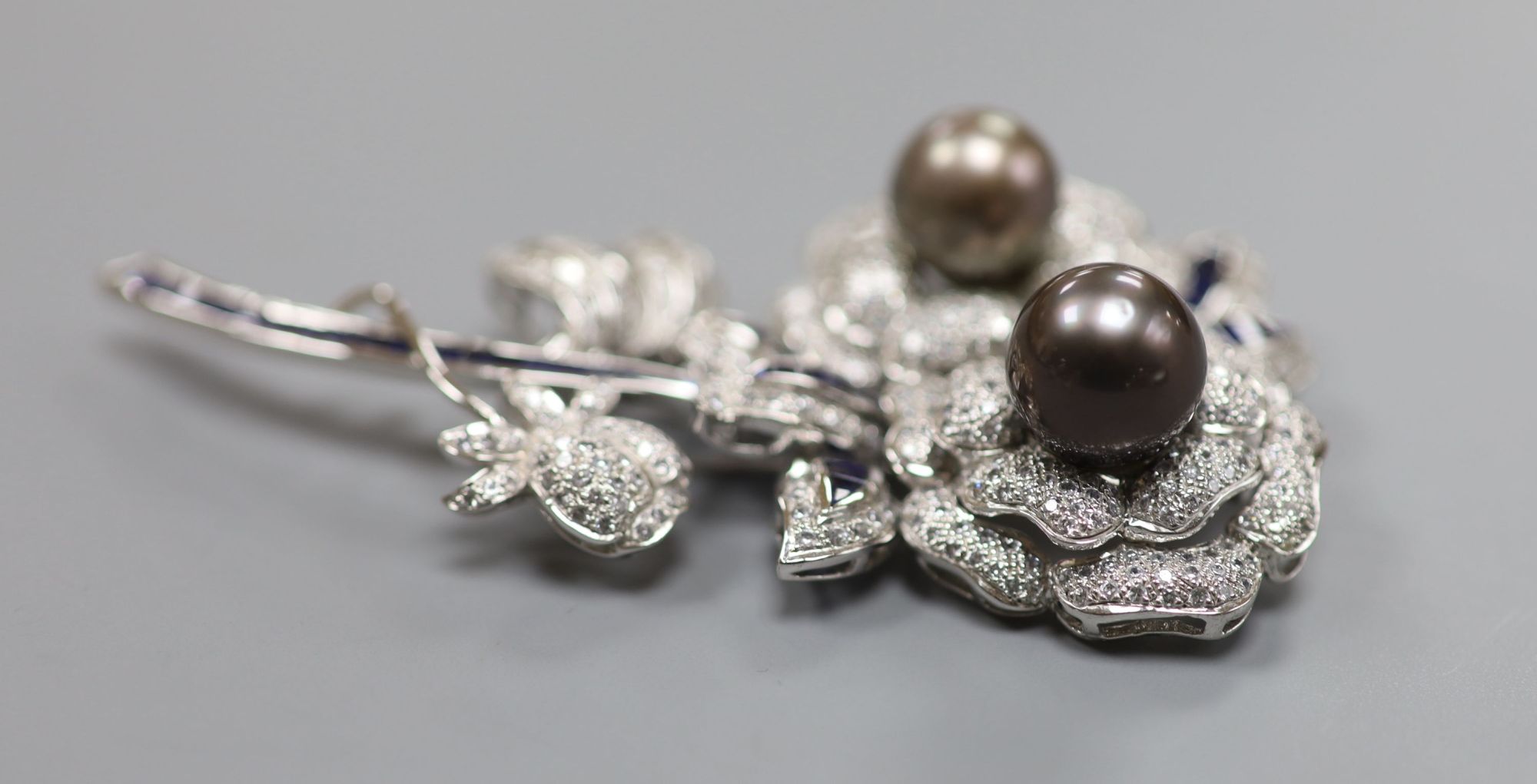 An ornate tahitian pearl and two colour paste? set costume floral spray clip brooch, 84mm.